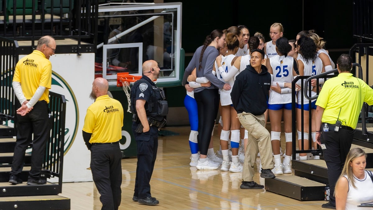 The San Jose State University Spartans are flanked by Moby Arena security, campus police and their own private guard during an NCAA Mountain West women’s volleyball game against the Colorado State University Rams at Moby Arena in Fort Collins, Colorado, on Thursday, October 3, 2024.