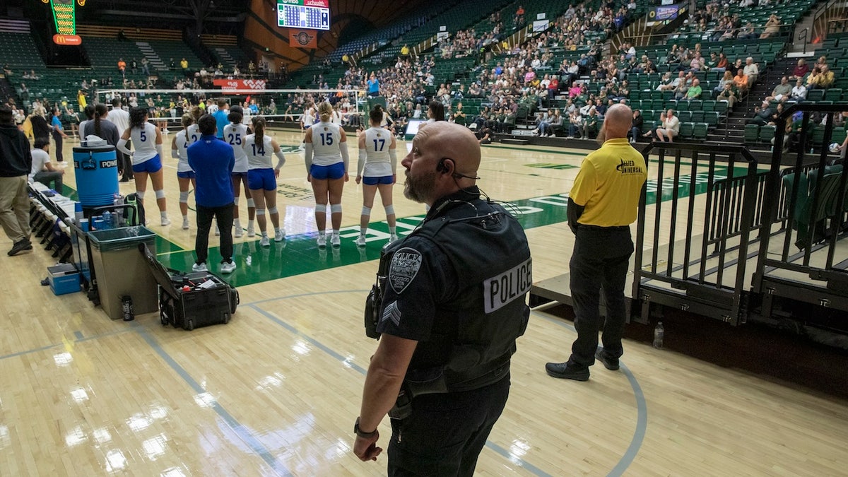 police at volleyball match 