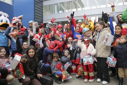 Superheroes drop off Christmas gifts to young Kosovo cancer patients