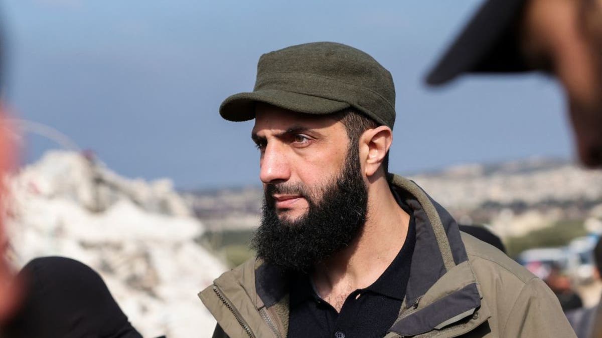 Hayat Tahrir al-Sham chief Abu Mohamed al-Golani checks the damage following an earthquake in the village of Besnaya in Syria's rebel-held northwestern Idlib province at the border with Turkey, on Feb. 7, 2023.