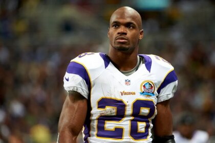 Ex-NFL star Adrian Peterson has warrants out for arrest: report