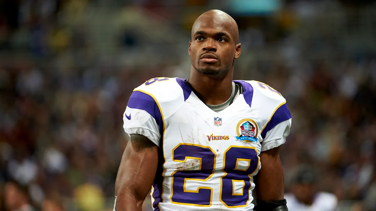 Ex-NFL star Adrian Peterson has warrants out for arrest: report