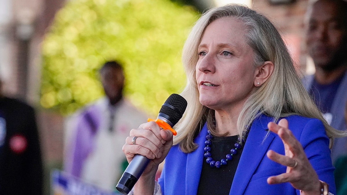 Rep. Abigail Spanberger of Virginia holds microphone