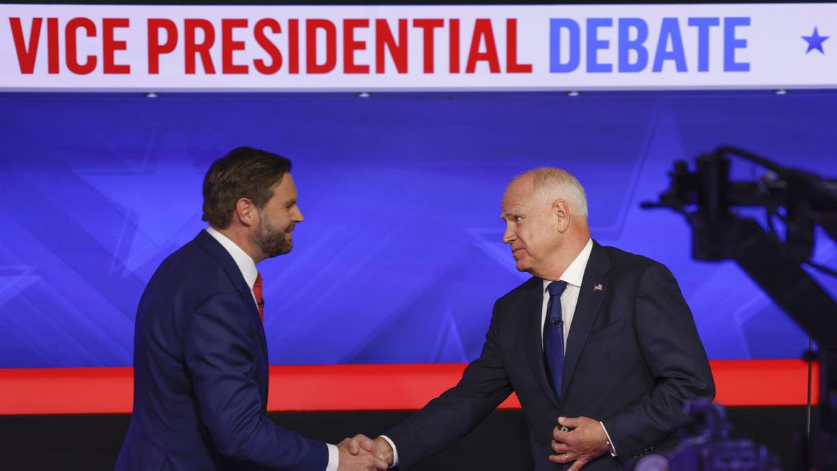 JD Vance and Tim Walz shake hands after debate