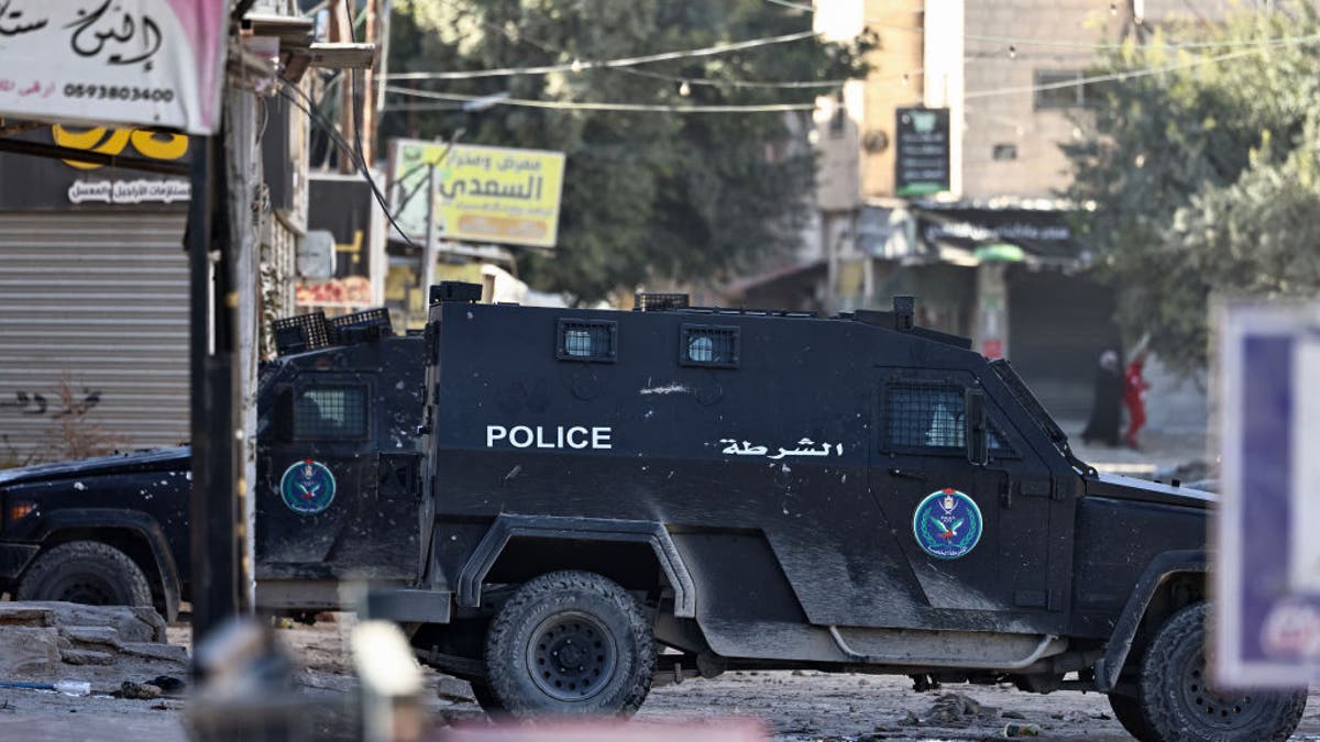 Palestinian Authority security forces vehicles block a road amid clashes with militants in the Jenin camp in the Israel-occupied West Bank on Dec. 15, 2024. For more than a week, the northern West Bank city of Jenin has seen intense violence, after the PA, which coordinates security matters with Israel, arrested several militants.