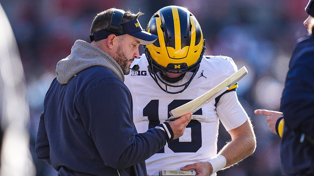 Kirk Campbell talks to quarterback