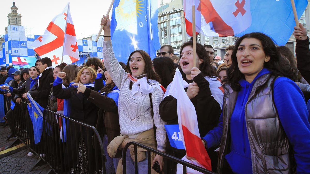 Supporters of the ruling Georgian Dream Party attend a rally in the center of Tbilisi, Georgia, on Wednesday, Oct. 23, 2024.