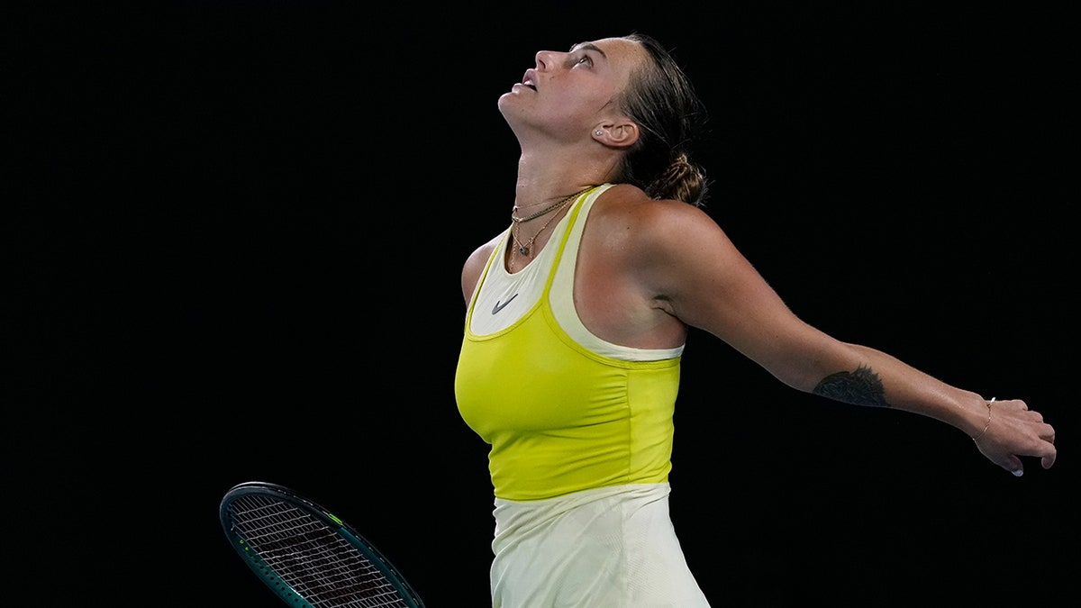 Aryna Sabalenka looks up on tennis court