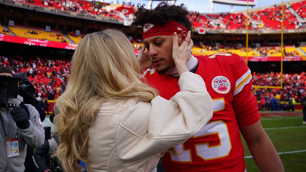 Brittany Mahomes goes for a kiss