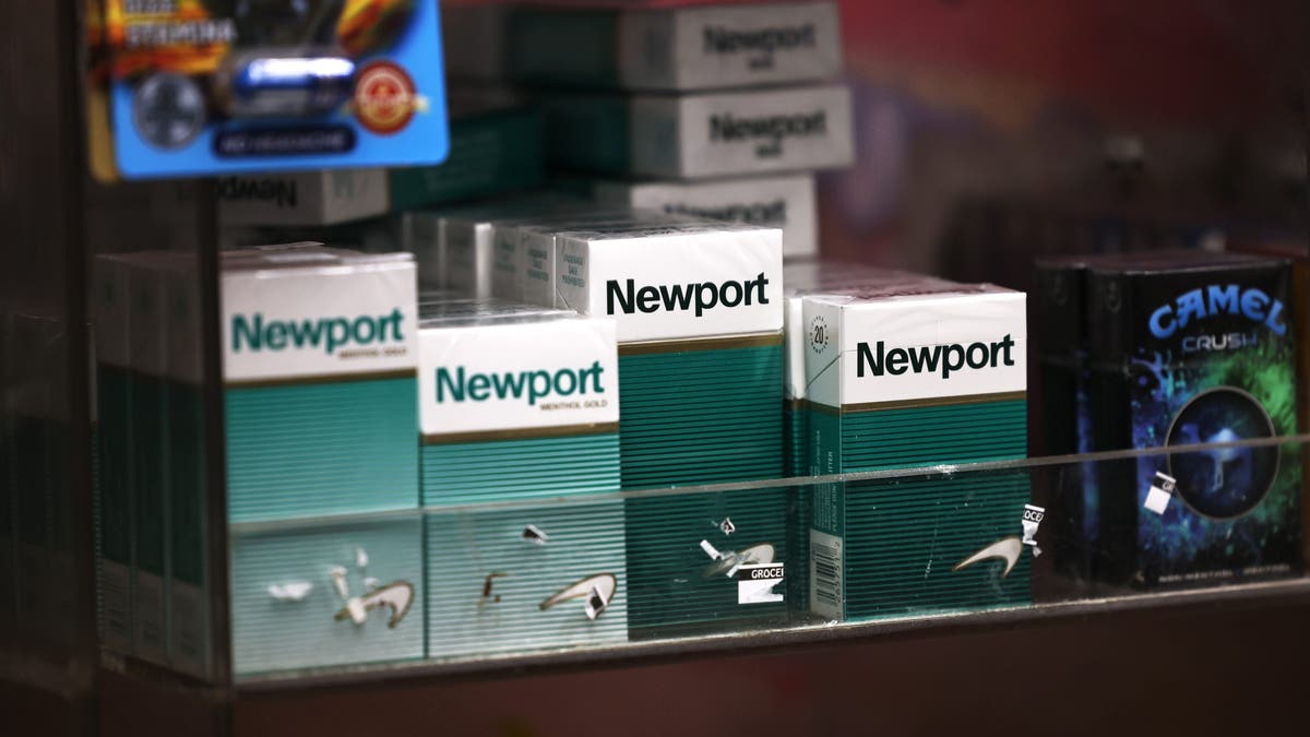 Packs of Newport cigarettes are seen on a shelf in a grocery store in the Flatbush neighborhood on April 29, 2021 in the Brooklyn borough of New York City. 