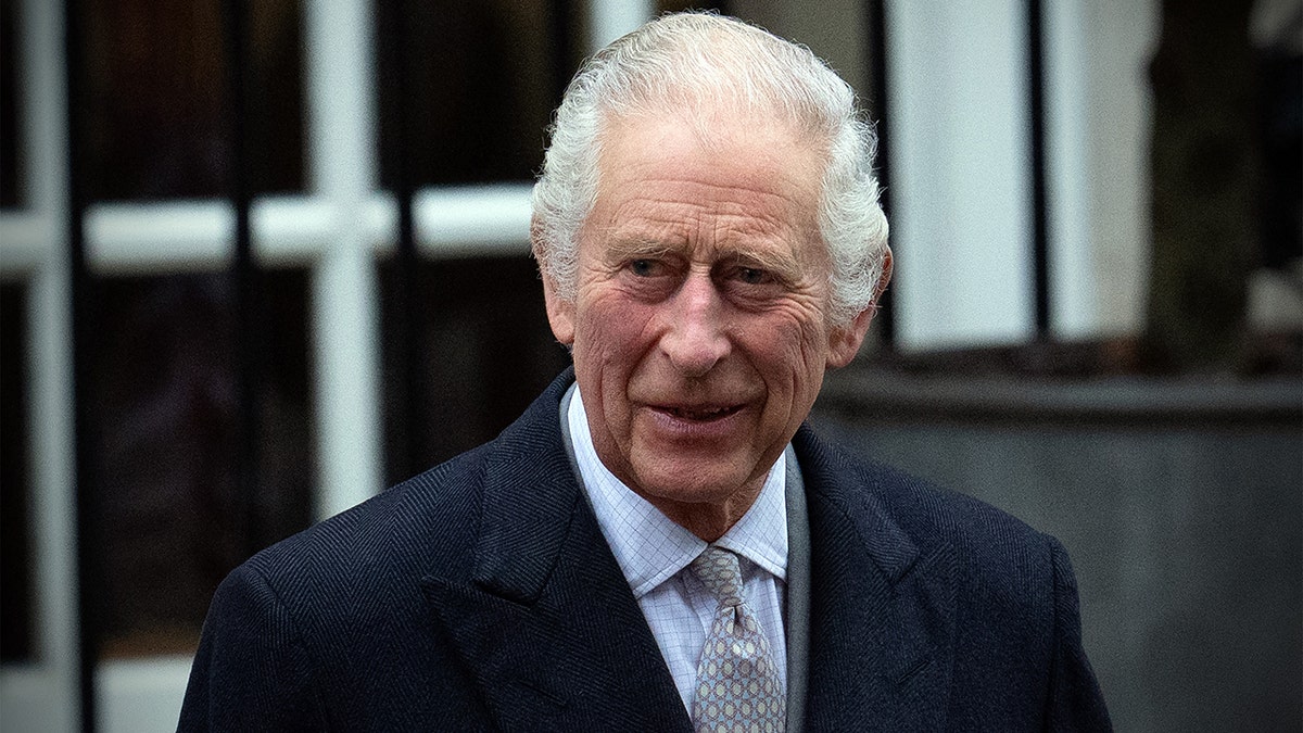 A close-up of King Charles smiling