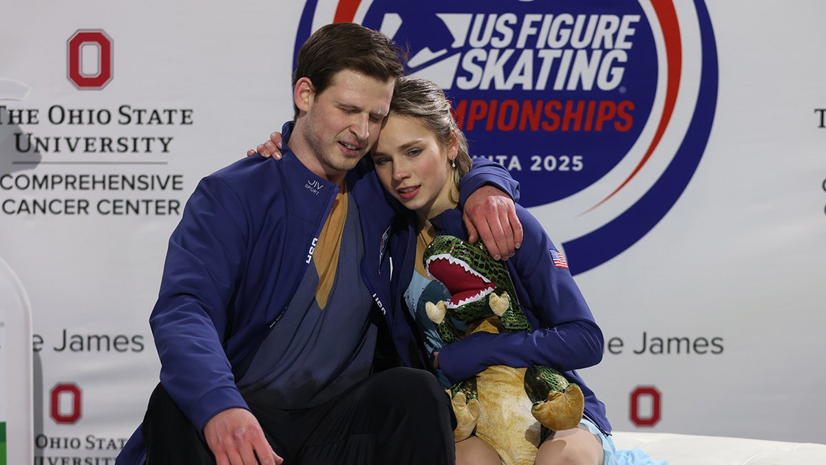 Misha Mitrofanov and Alisa Efimova hug