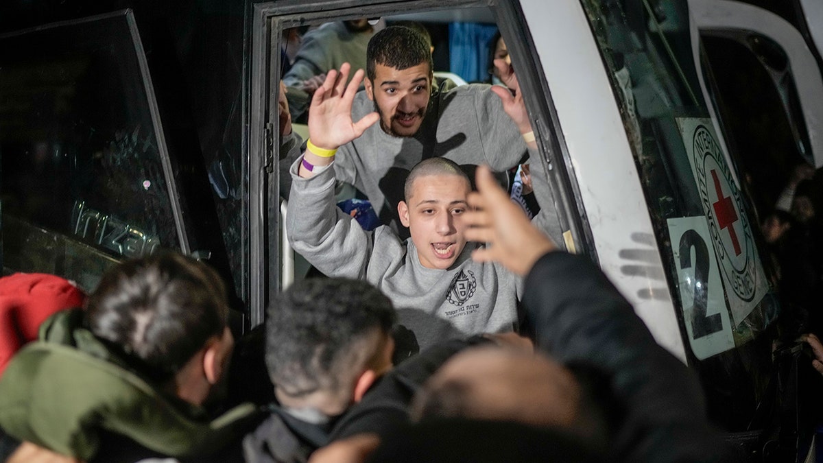 Palestinians depart bus after being released from Israeli prison