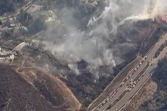 Residents evacuated as brush fire threatens homes near San Diego