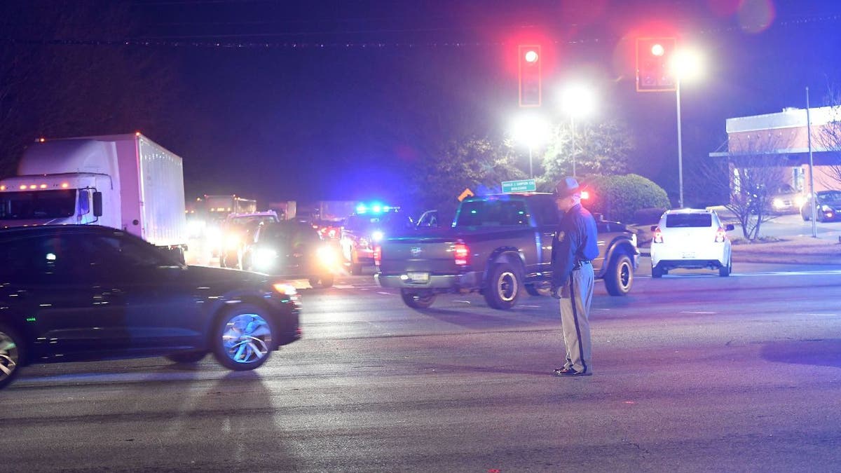 Police guiding traffic in I-85.