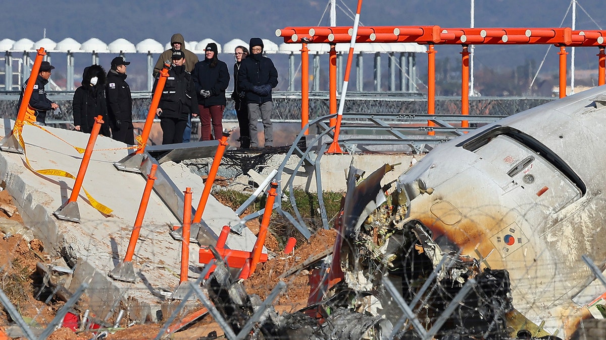 NTSB investigators look over South Korea plane crash site