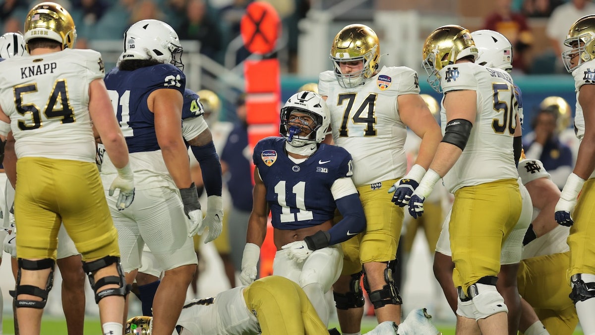 Penn State Nittany Lions defensive end Abdul Carter (11) celebrates a tackle on Notre Dame Fighting Irish quarterback Riley Leonard (13) in the first half at Hard Rock Stadium.