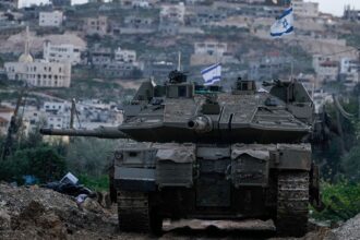 Israel moves tanks into West Bank for first time since 2002