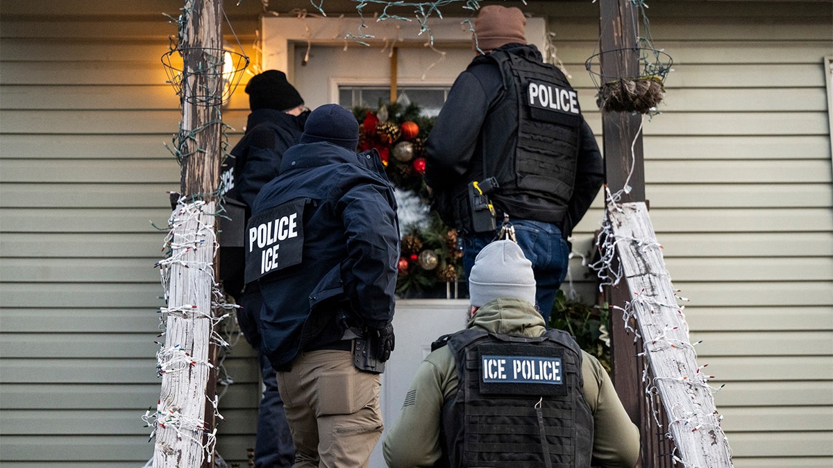 ICE lined up at front door to house 