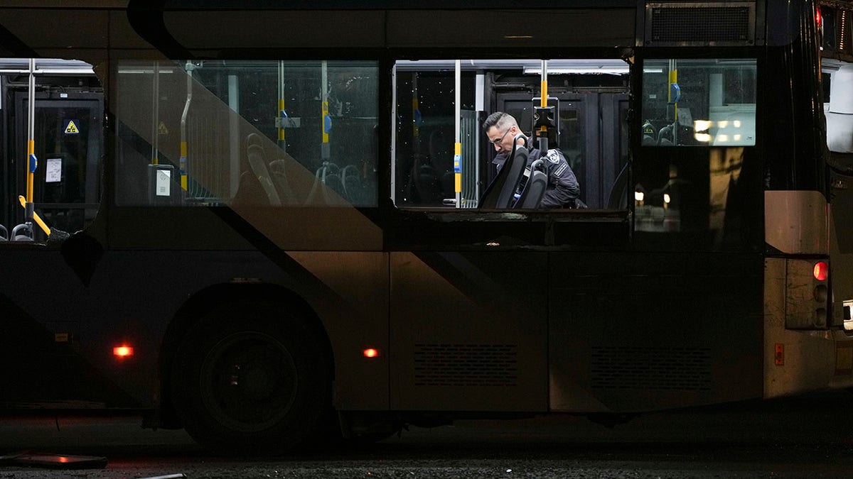 An Israel searches a bus