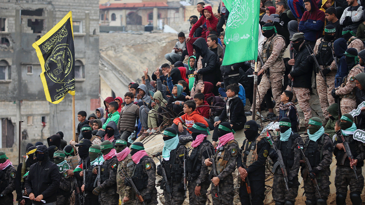 Palestinians watching hostage hand over