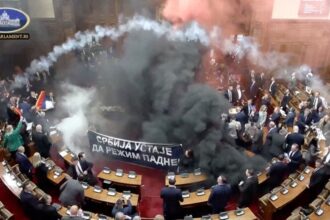 Serbian lawmakers throw smoke grenades, tear gas in parliament