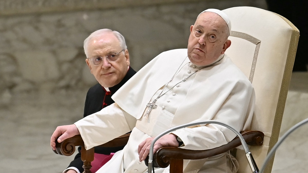 Pope sitting in a chair