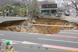 Motorcyclist who vanished into sinkhole is found dead following search