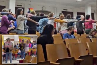 Trans activists storm NYC schools meeting, dance ‘Macarena’ to protest support of female athletes