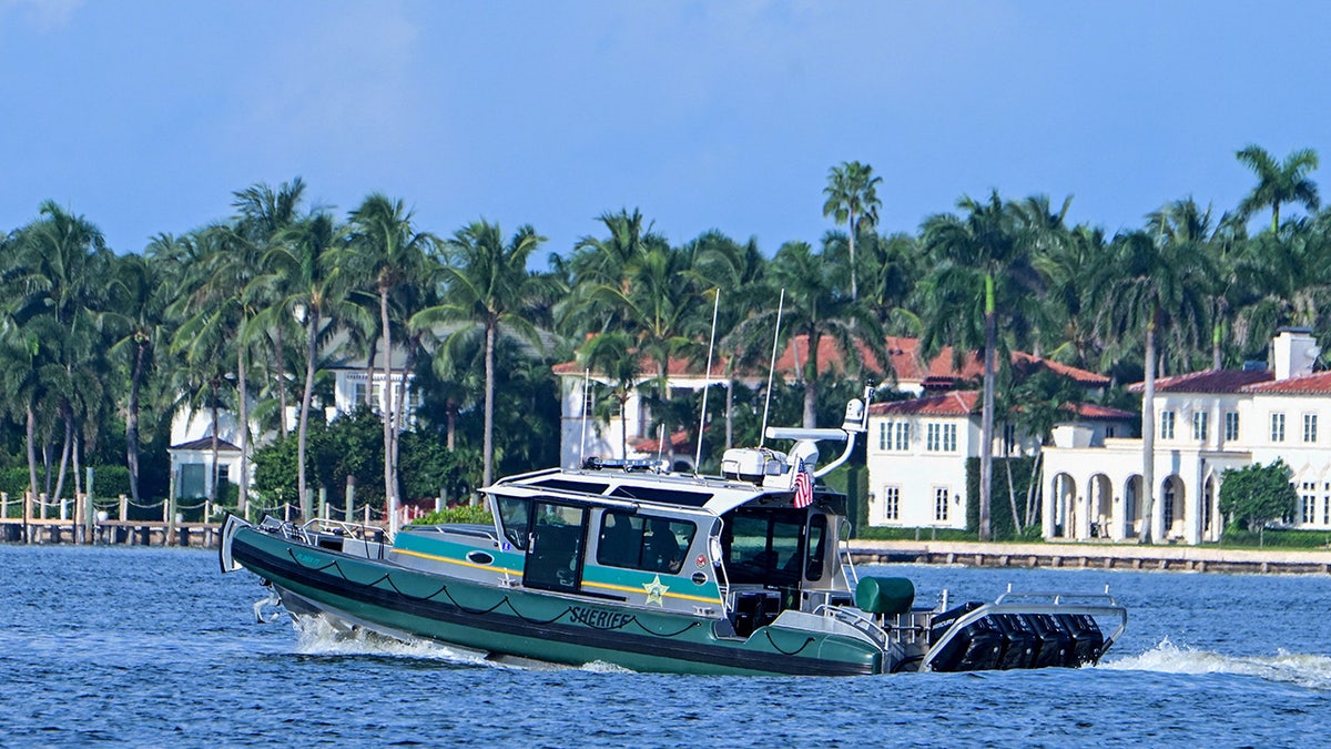 A Palm Beach County Sheriff patrol boat guards the waters around Mar-A-Lago