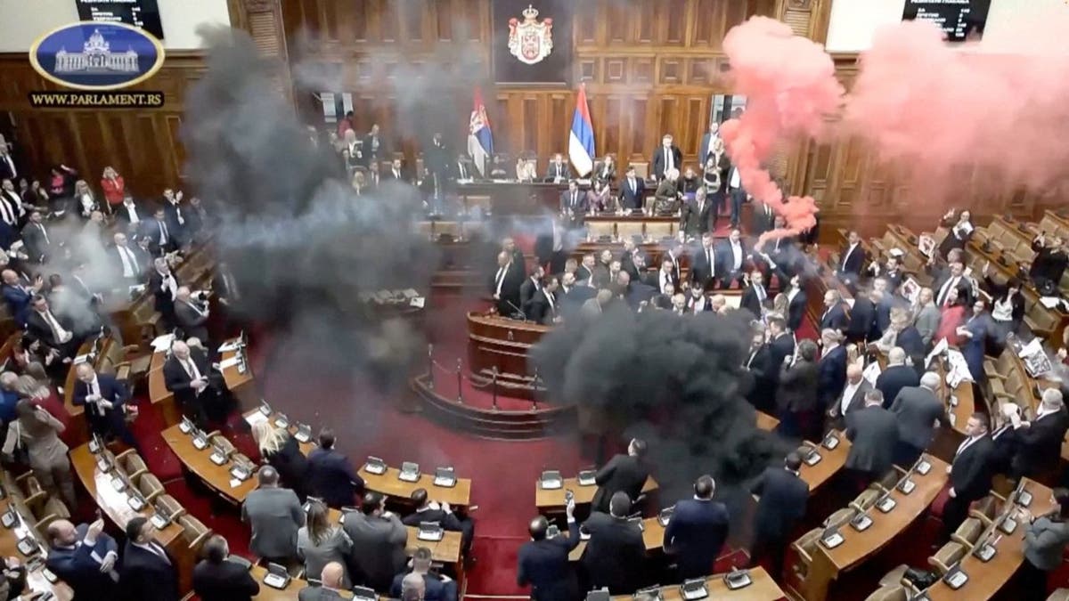 Serbian opposition lawmakers let off smoke grenades