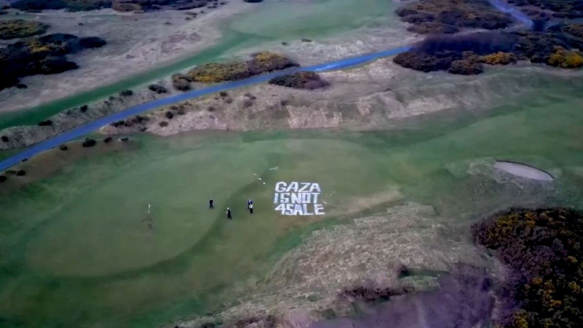 Drone footage shows "Gaza Is Not For Sale" in giant white letters painted on an area next to a green at Trump's Turnberry golf resort in Scotland.