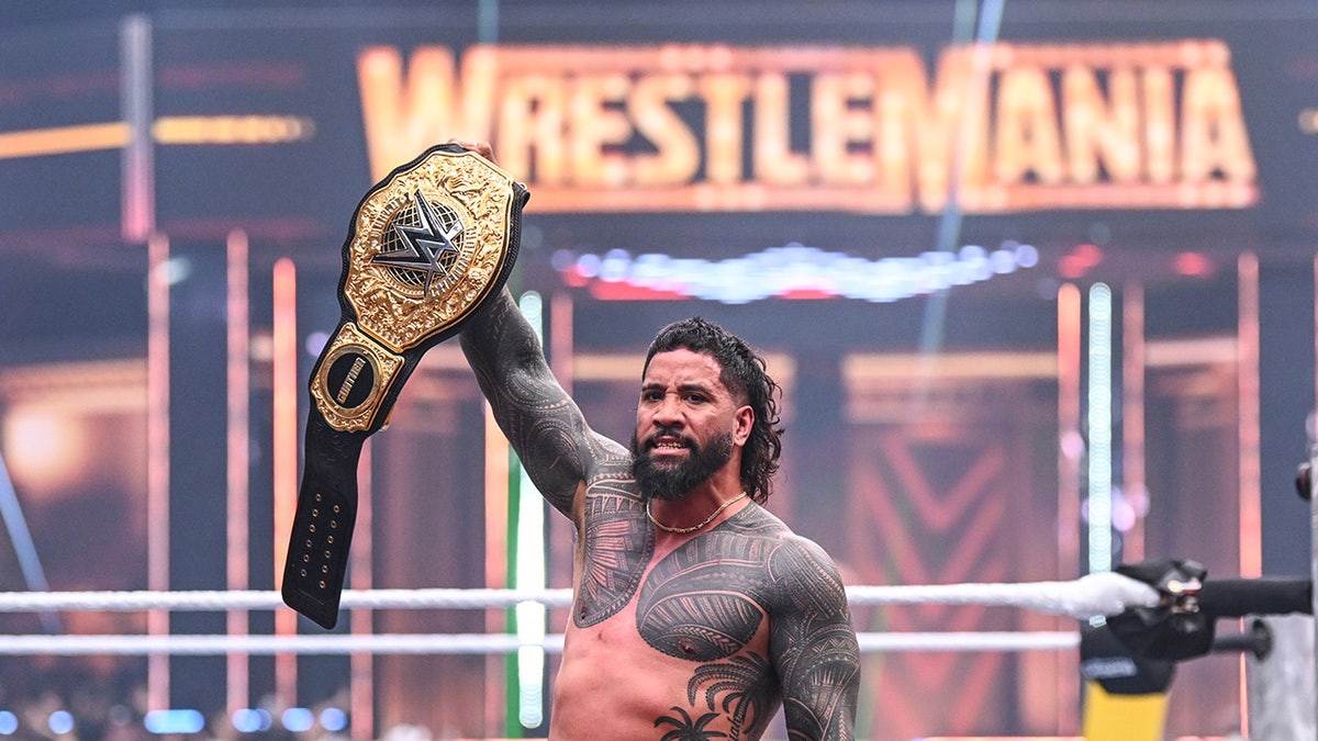 Jey Uso with the title