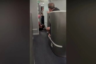 American Airlines passenger restrained, knocked to floor while barging into cockpit: video