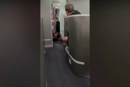 American Airlines passenger restrained, knocked to floor while barging into cockpit: video