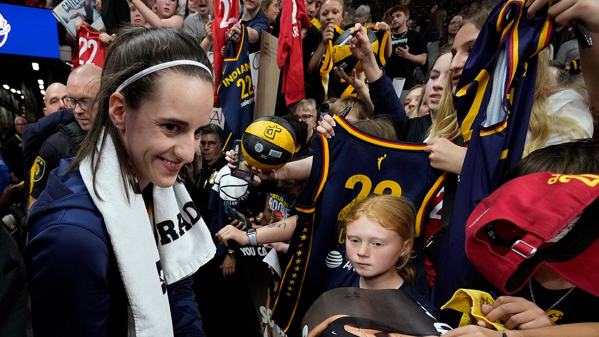 Caitlin Clark signs autographs