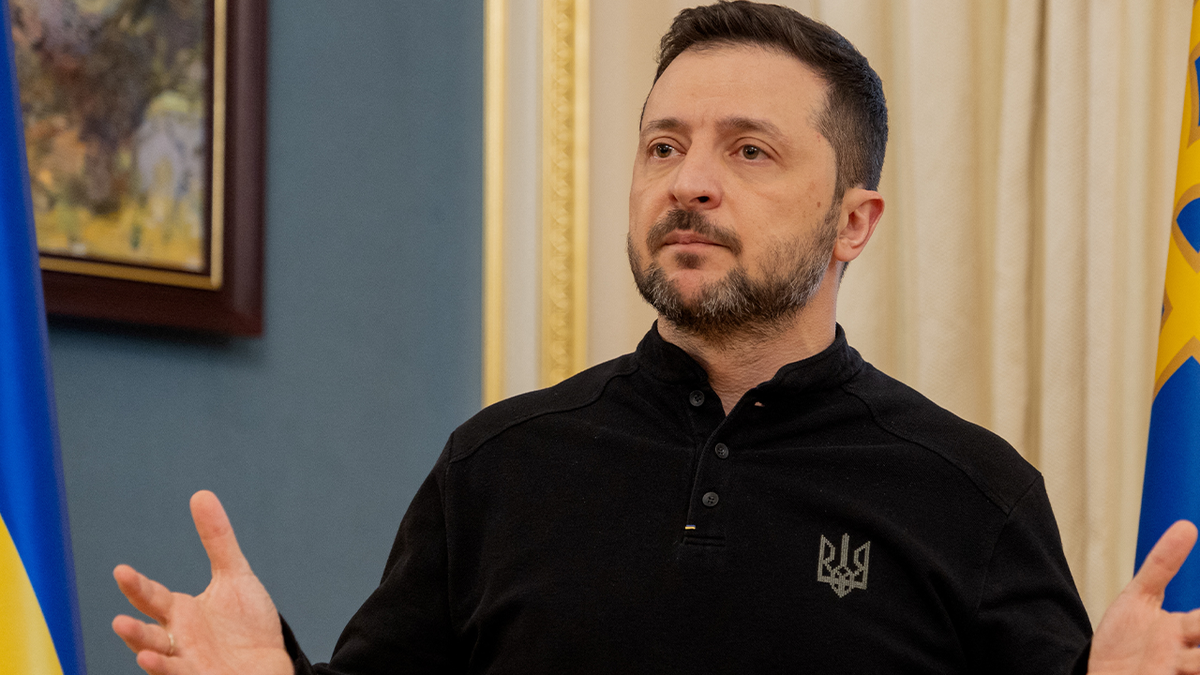 Zelenskyy with his hands up