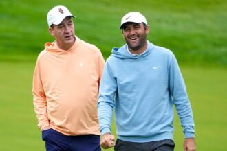 Scottie Scheffler breaks out in laughter after Peyton Manning’s errant tee shot reportedly hits house
