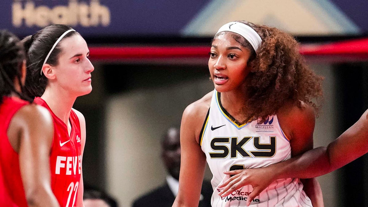 Angel Reese talks to Caitlin Clark