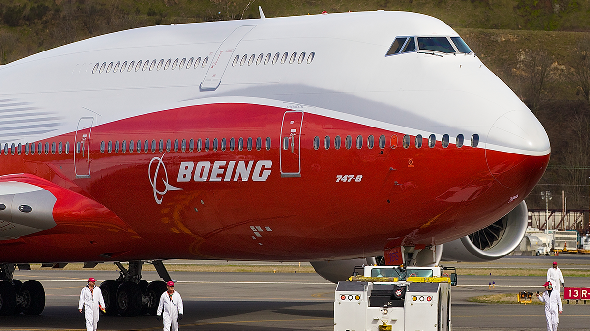 Boeing jet with red and white color scheme