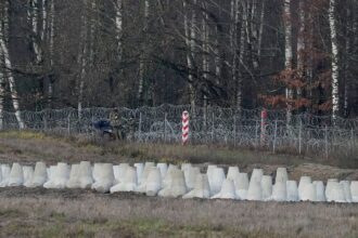 Poland adds minefields to border barriers with Russia