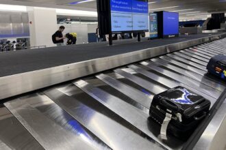 Newark baggage conveyor belt carries away 2-year-old boy, officers spring into action