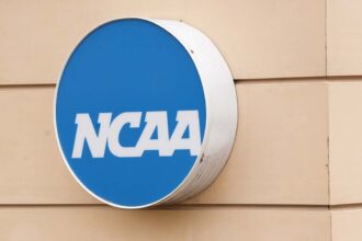Federal judge approves .8B settlement allowing schools to directly pay college athletes