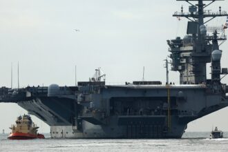 USS Nimitz carrier strike group sailing toward Middle East ahead of schedule, US official says