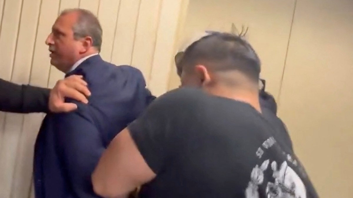 Brad Landers being arrested