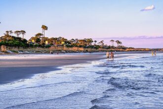 Two shark attacks reported in separate vacation hotspots as summer beach season starts