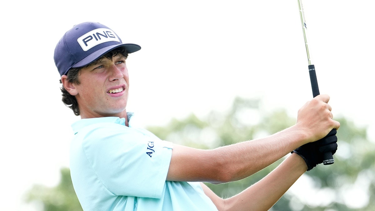 Mason Howell finishes golf swing
