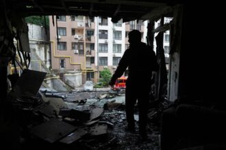 Russian strikes on Kyiv kill one as fires break out in the city