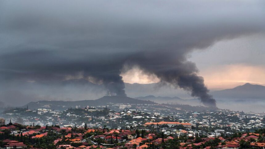 A year after riots, France hosts summit on future of New Caledonia