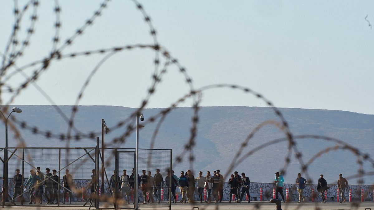 Hundreds of migrants moved to Greek mainland as Libyan arrivals surge
